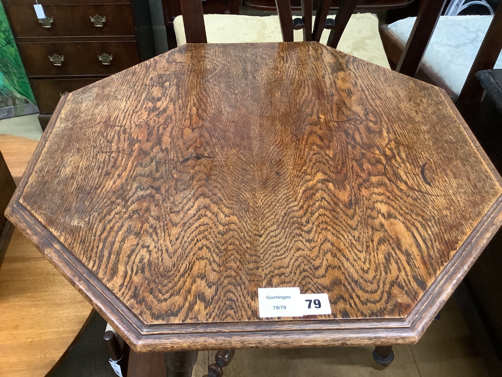 An Edwardian octagonal oak occasional table, width 60cm depth 62cm